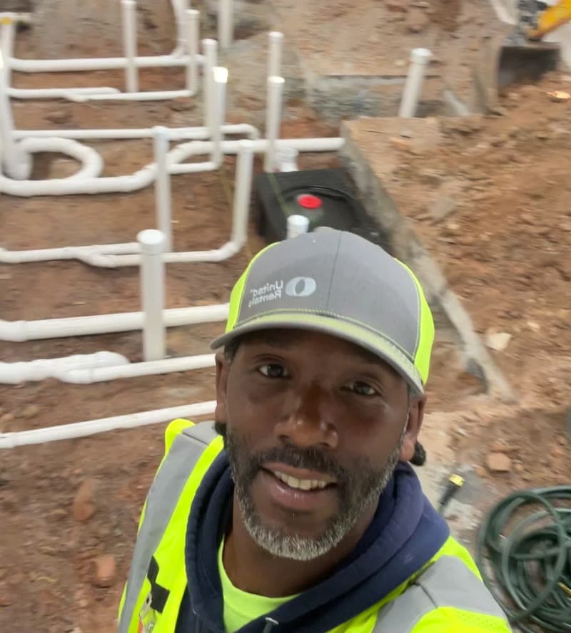 A Carolina's A1 Plumbing Service technician on the job site